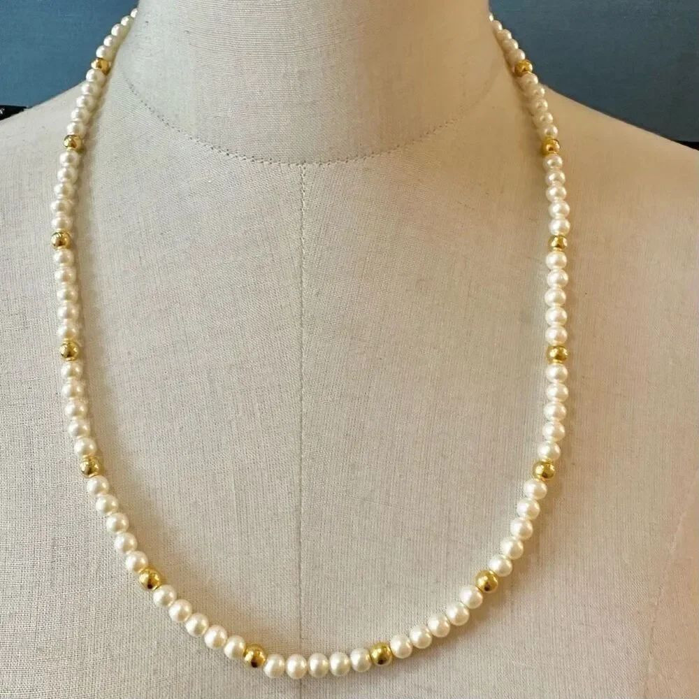 Faux pearl and gold tone long necklace